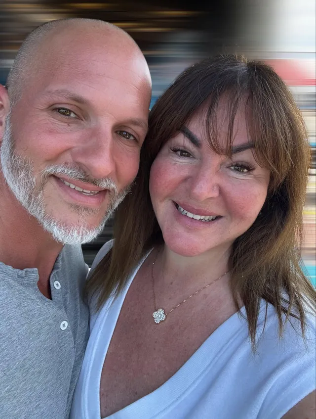 Daniel and Mel Brown smiling together in a close-up photo
